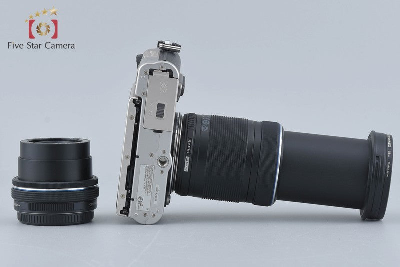 Count 717 Olympus PEN E-PL8 Silver 16.1 MP 14-42 40-150 Lenses [Very Good]