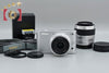 "Count 4,286" Nikon 1 J1 Silver 10.1 MP Digital Camera + Double Lens Kit